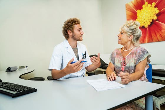 Care professional and patient talking with each other