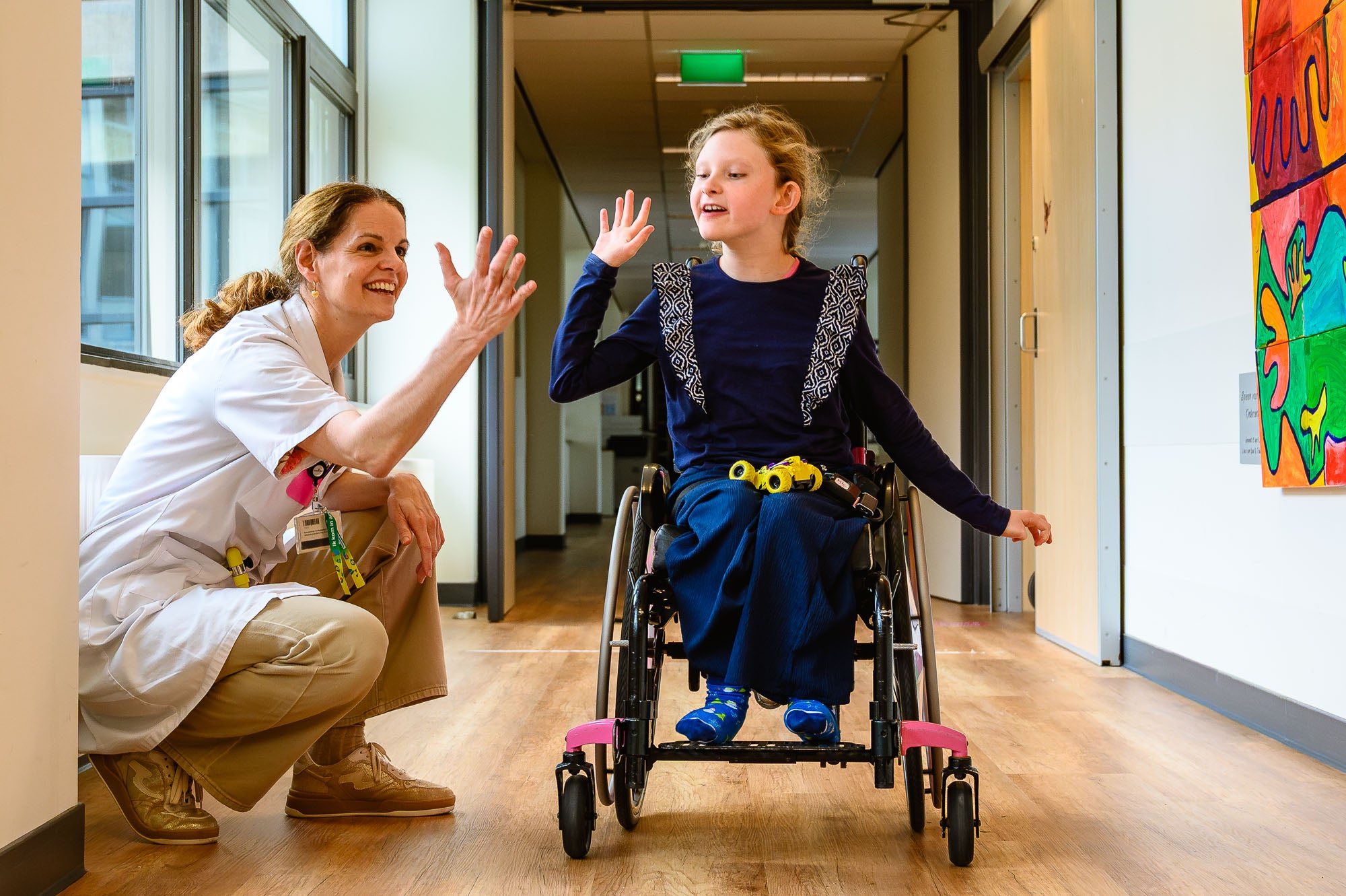 Inge Cuppen met kind in rolstoel