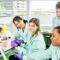 Diverse group of Biomedical Sciences students working in a lab